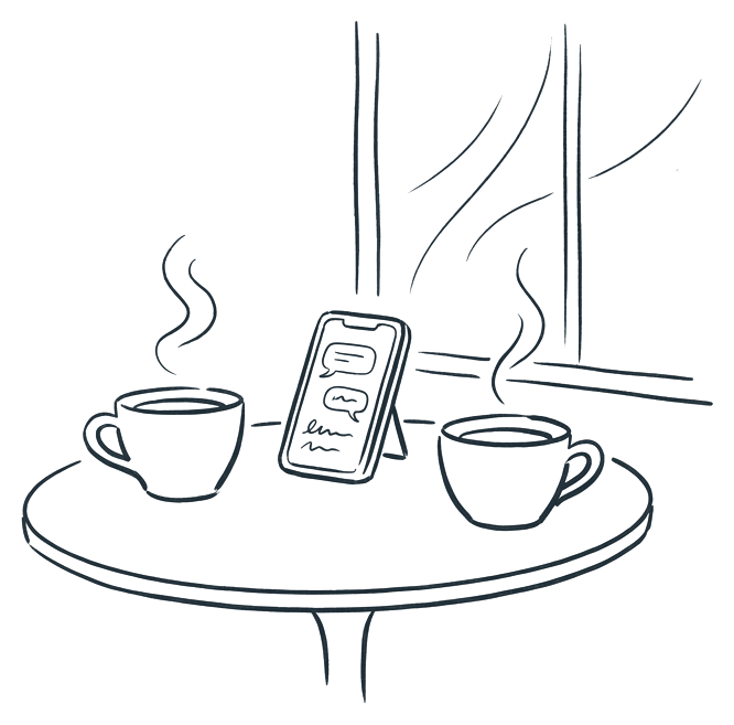 Two cups of tea on a small table with a phone showing a chat between them.
